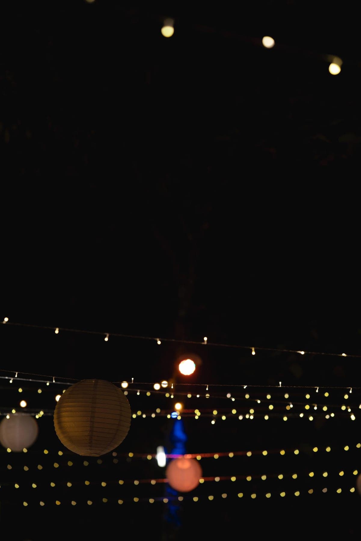 Festoon lighting above the reception after sunset