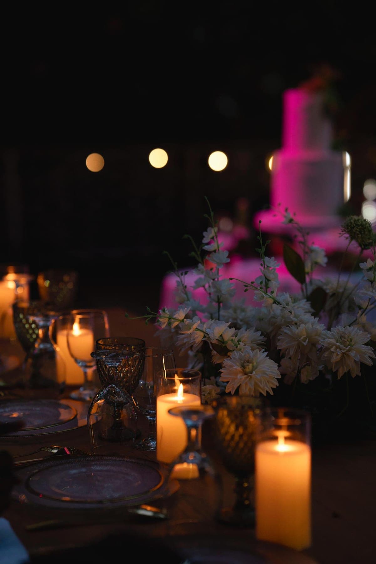 Paper lanterns and festoon lights strung through the trees